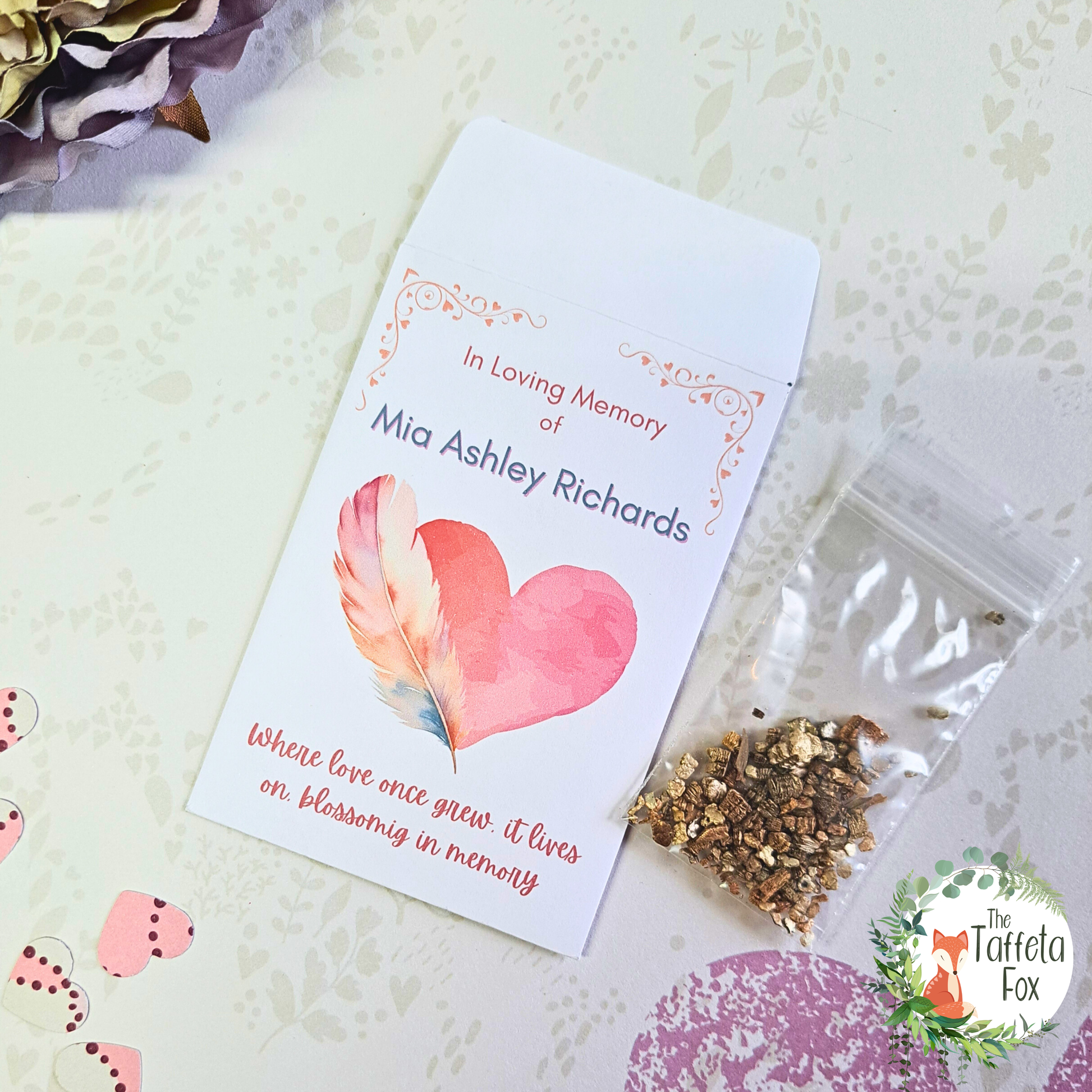 Personalised funeral seed favour with heart and feather artwork, memorial wildflower seed packet for remembrance.
