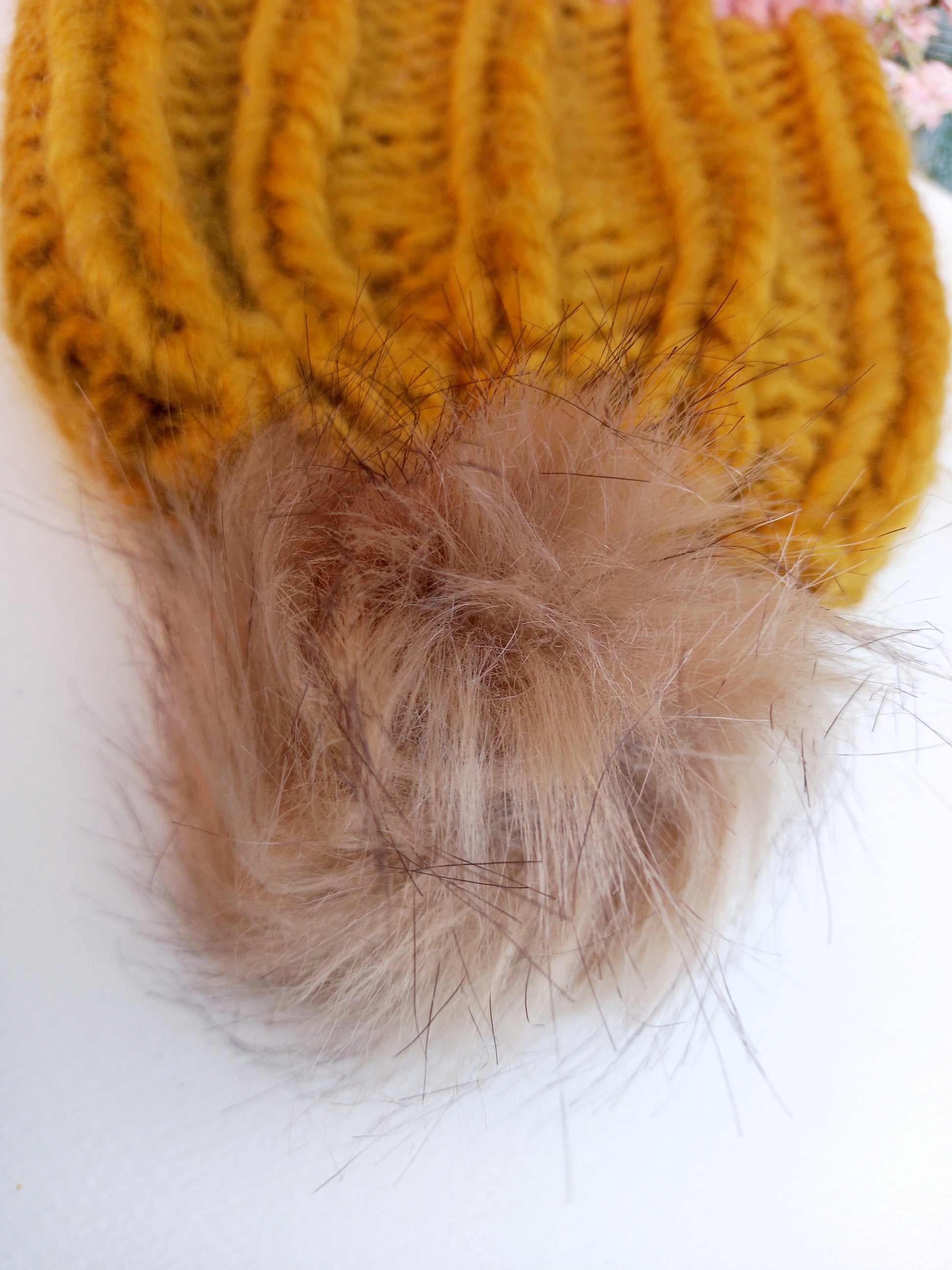 This image shows a close up of the fluffy pompom. 